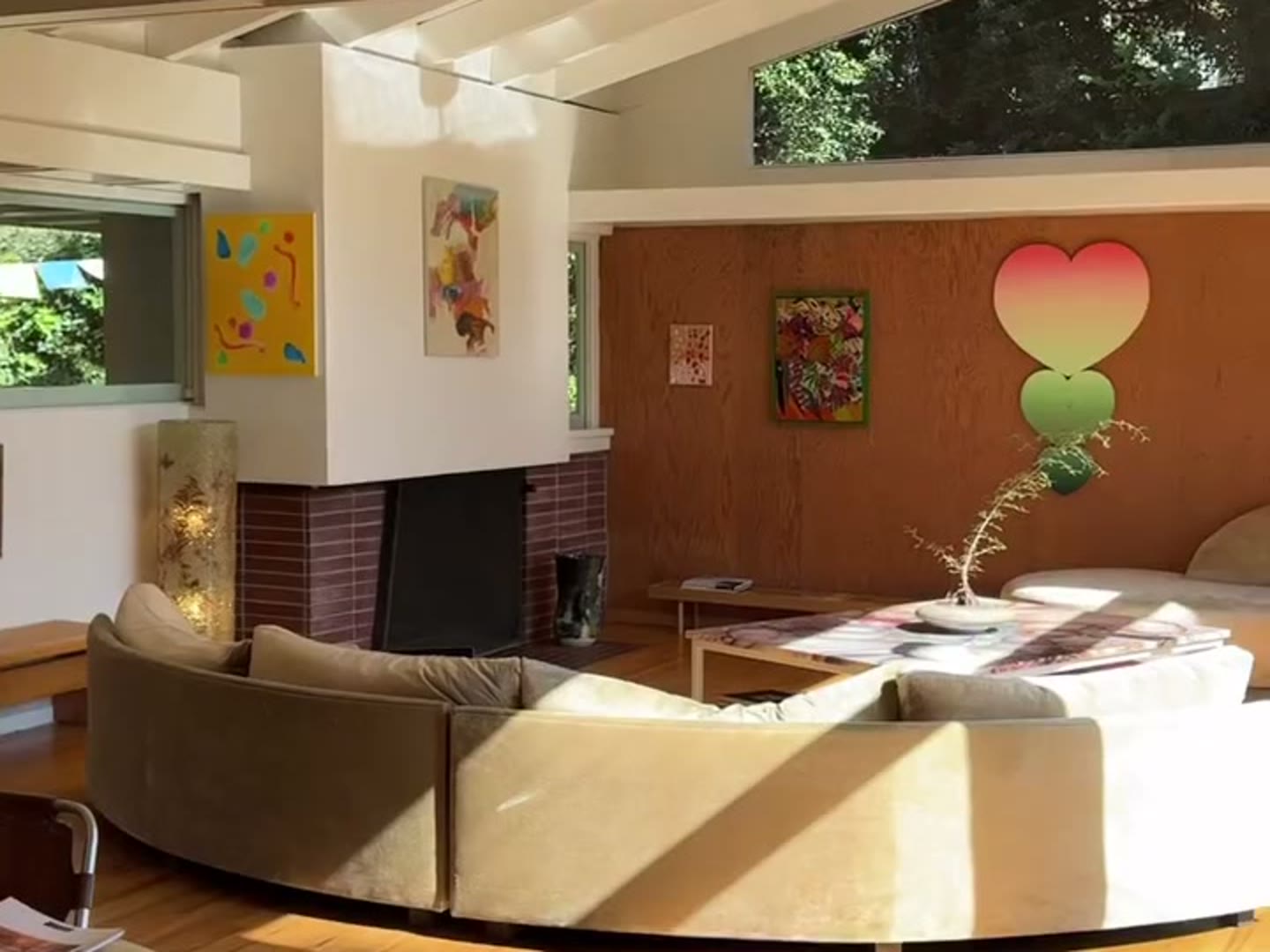 Sunlit living room beneath the pitched clerestory roof of the Druckman Residence